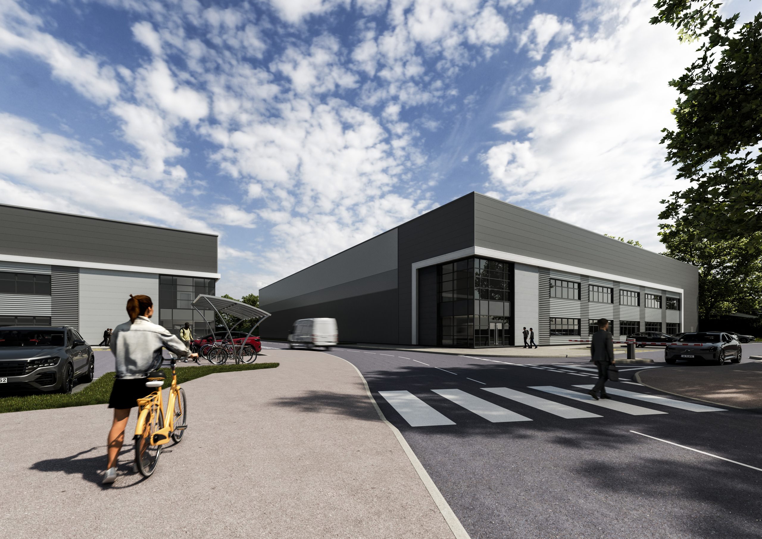 Modern industrial unit with integrated office space at Birmingham Business Park, featuring pedestrian access, parking, and landscaped surroundings.