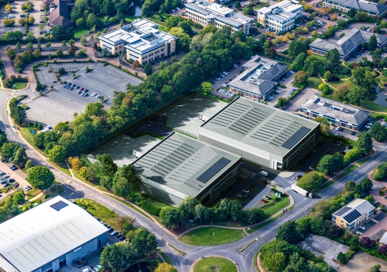 Aerial view of Project Diamond industrial warehouse development at Birmingham Business Park, showing two modern logistics units and surrounding infrastructure.